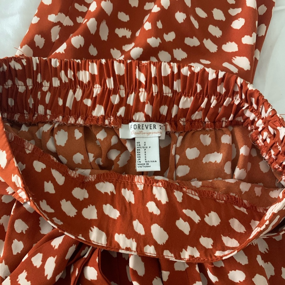 Dark orange/red and cream spotted flowery pants